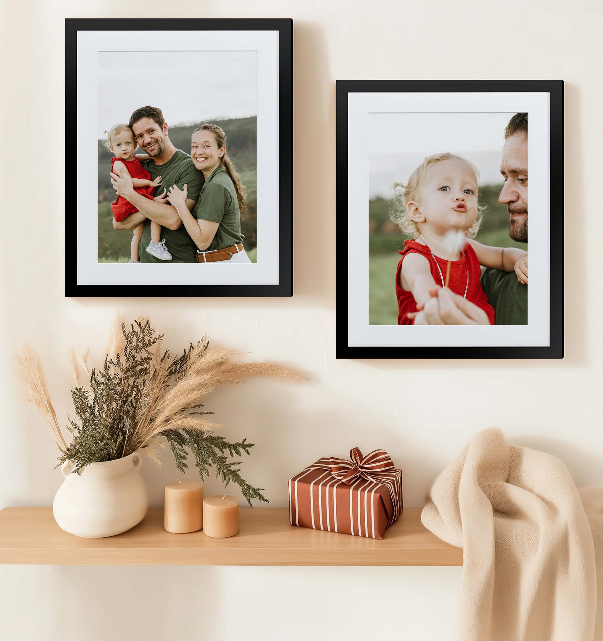 two framed prints of a cute family in the snow