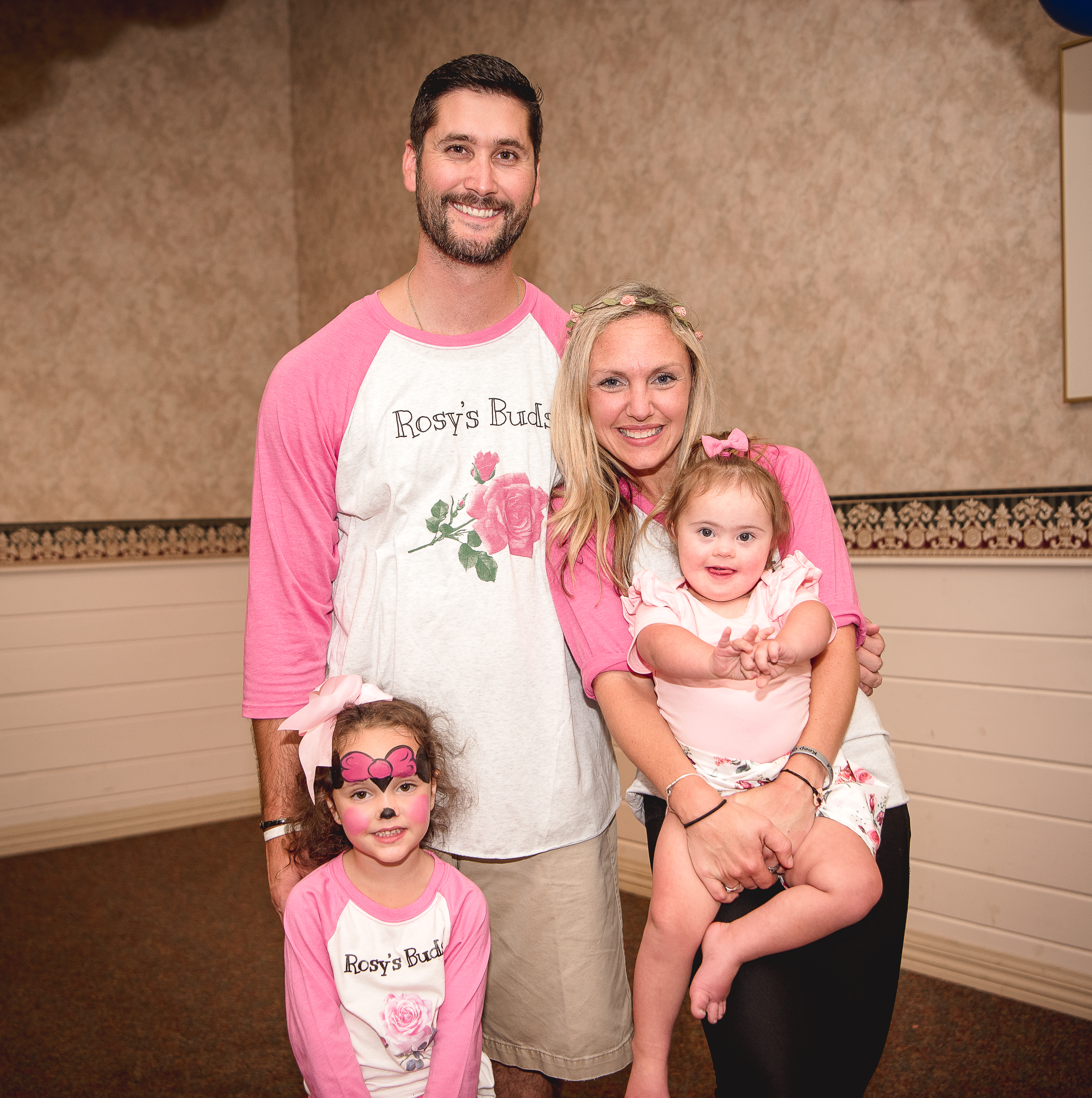 Two members of the NHDSA smiling with their kids and wearing matching "Rosy's Buds" t-shirts