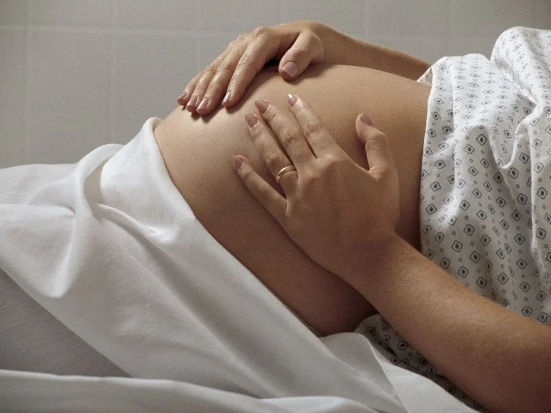 woman-holding-pregnant-stomach