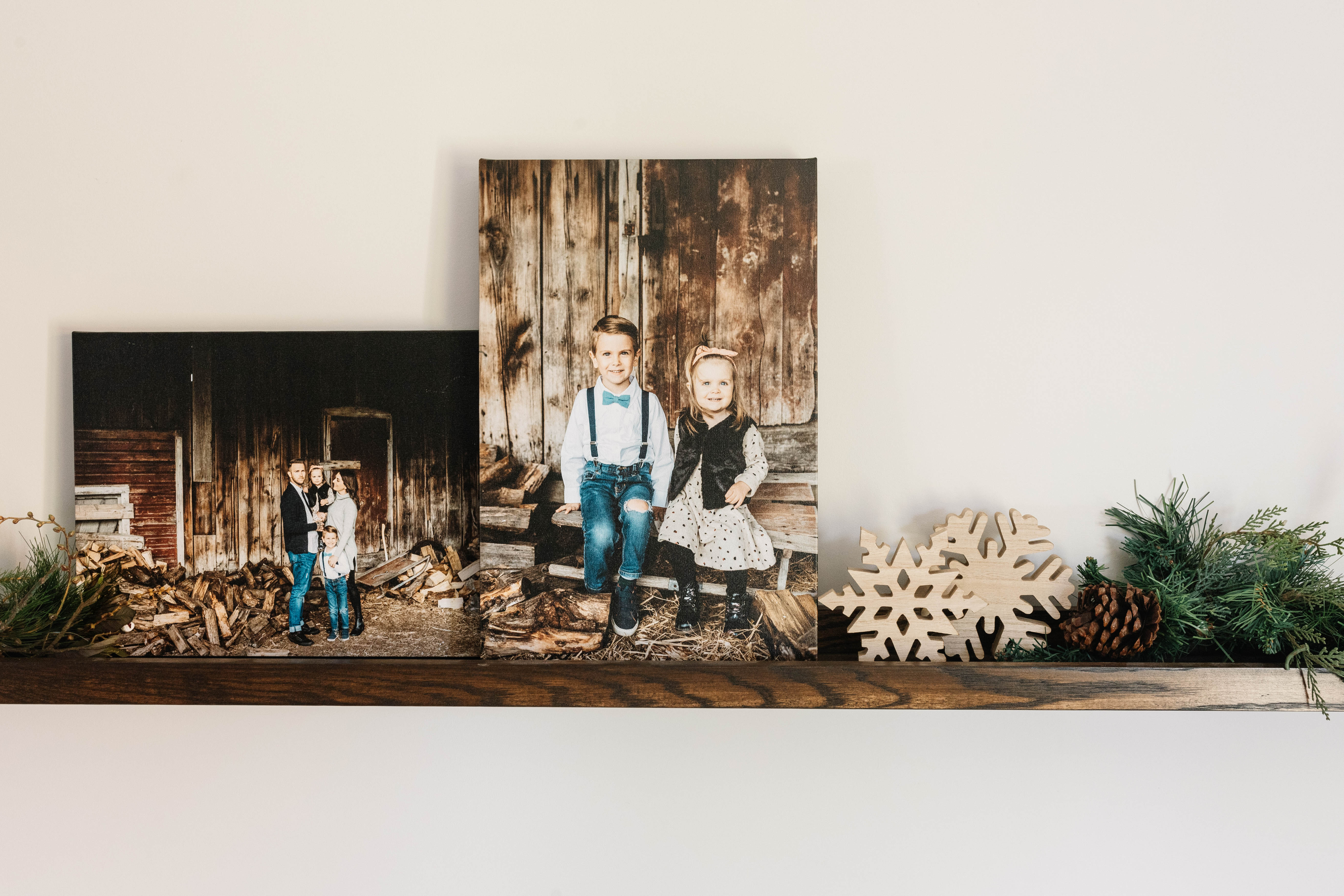 Canvas prints on shelf of family