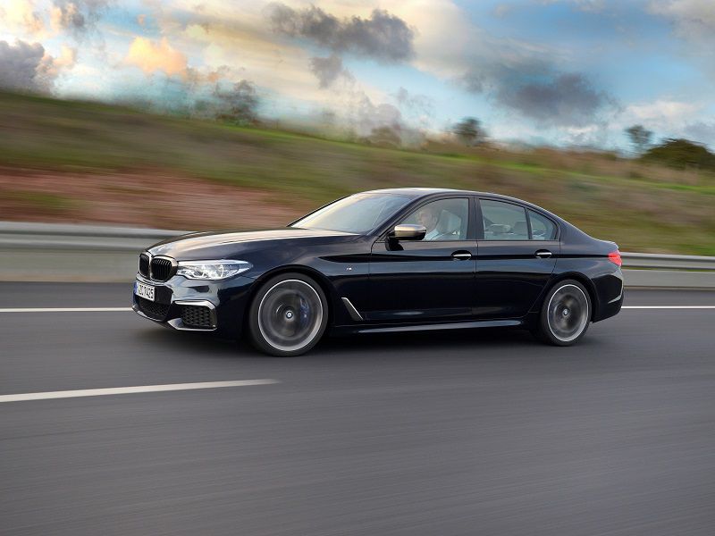 2020 BMW M550i Dark Blue Driving Side Profile ・  Photo by BMW 
