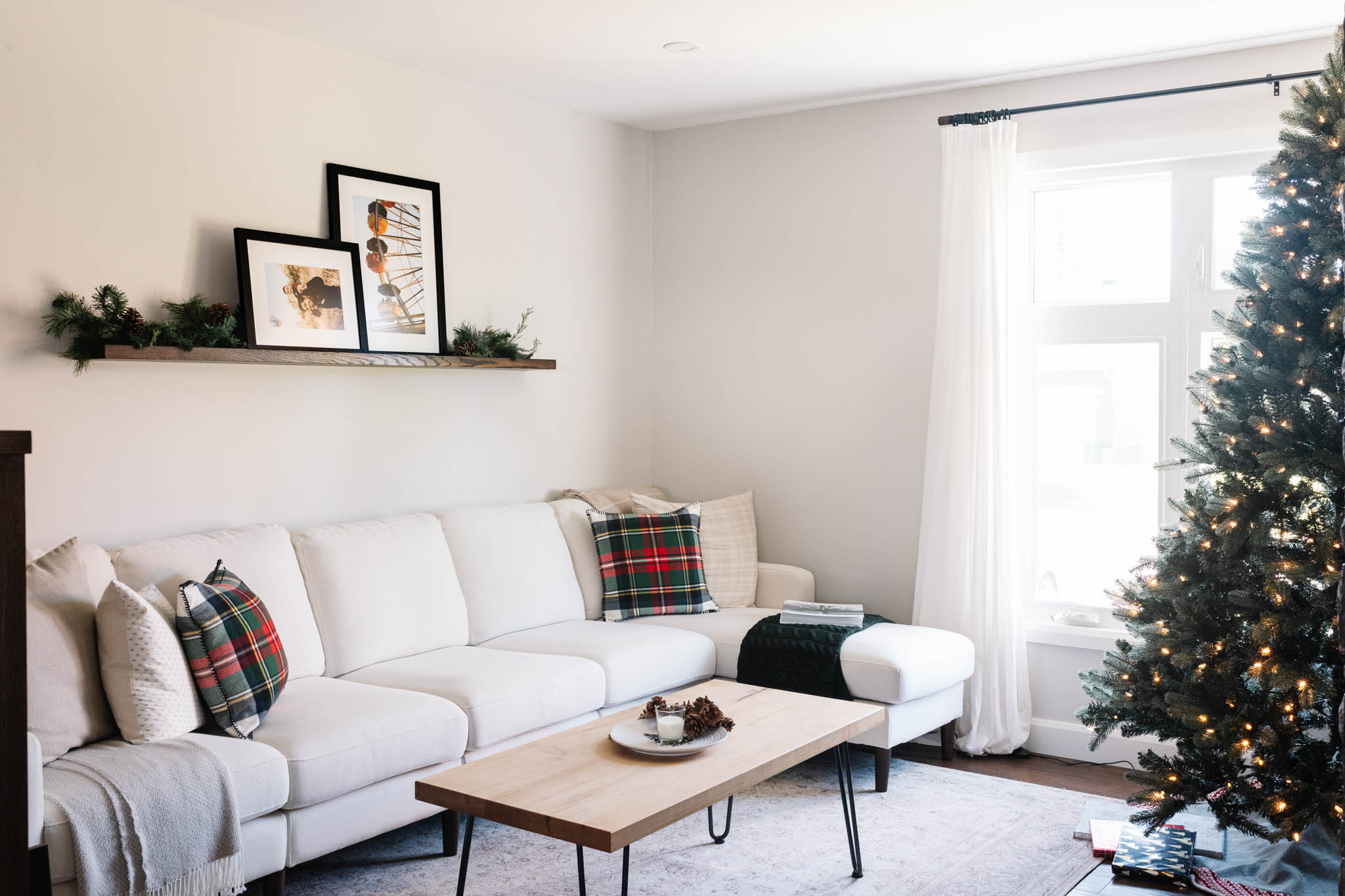 Framed prints in living room of ferris wheel and father and son