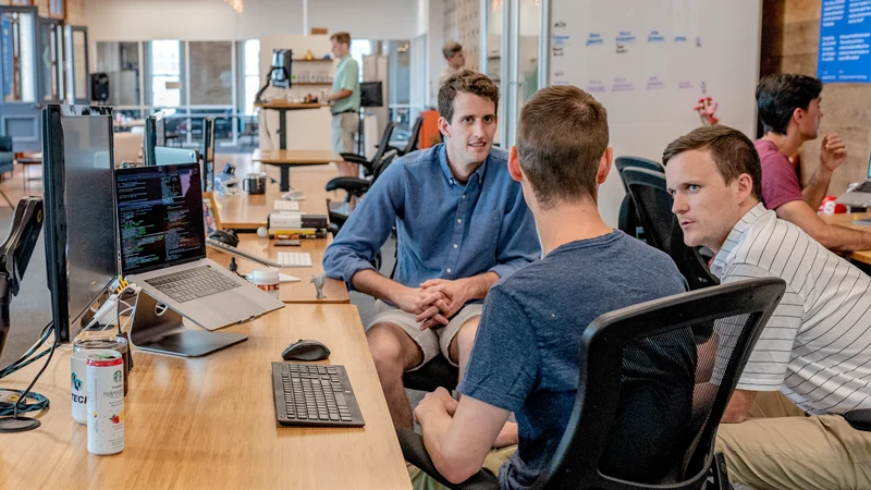 three marketers in a meeting