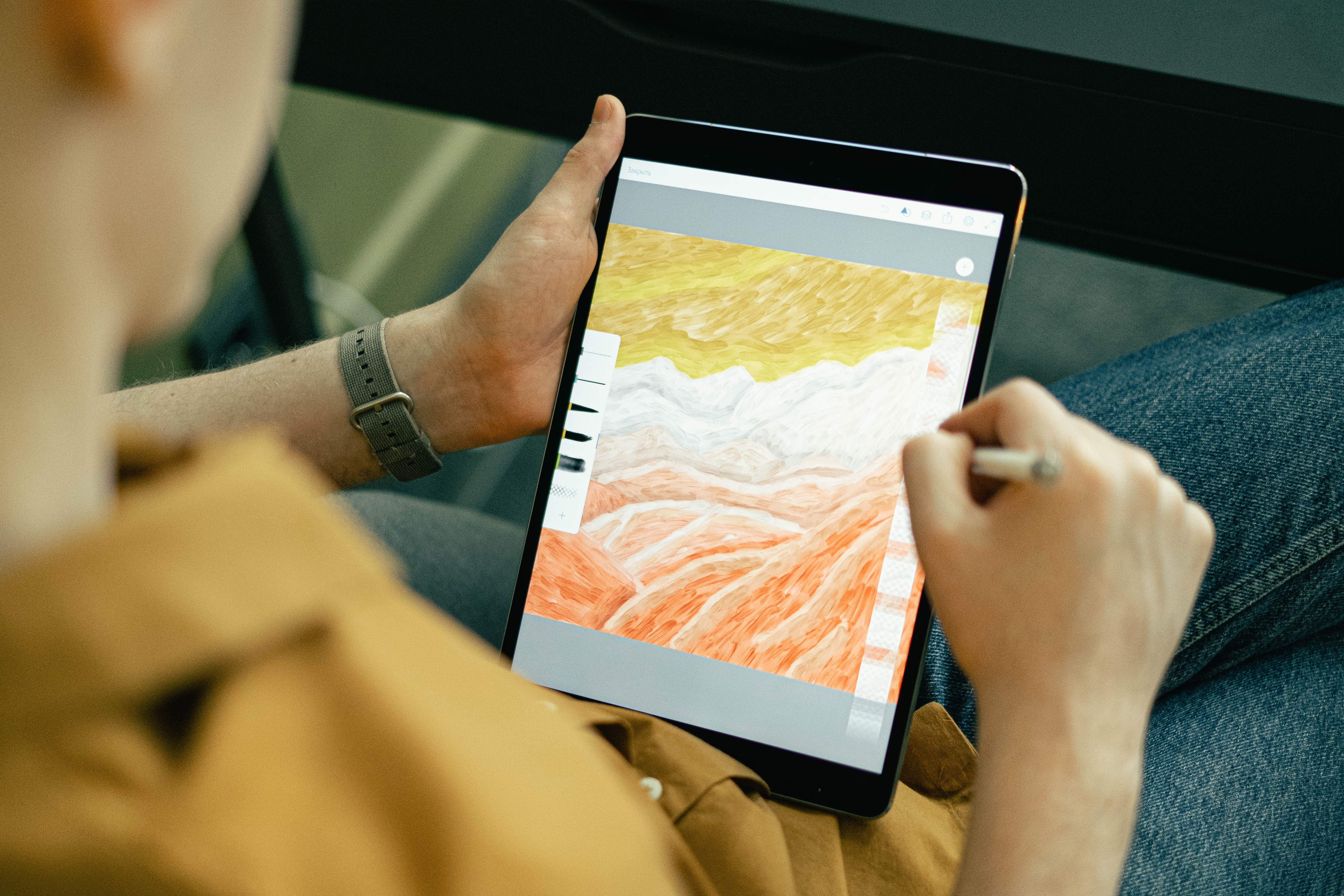 Artist drawing digital art on an ipad