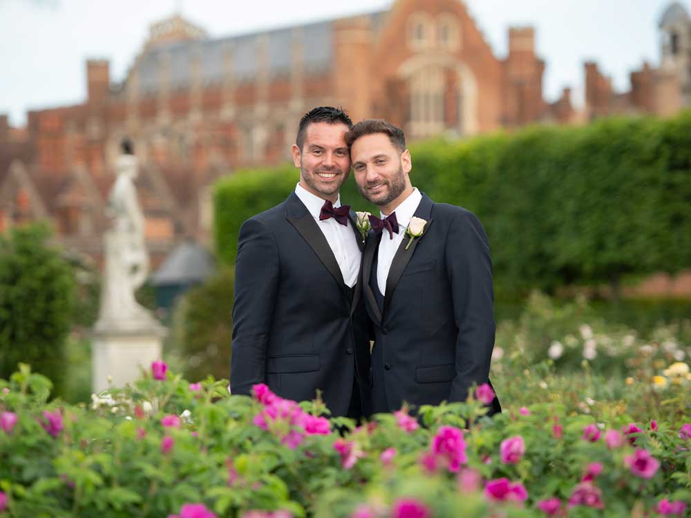 William & Jonathan with backdrop of Hampton Court palace wedding