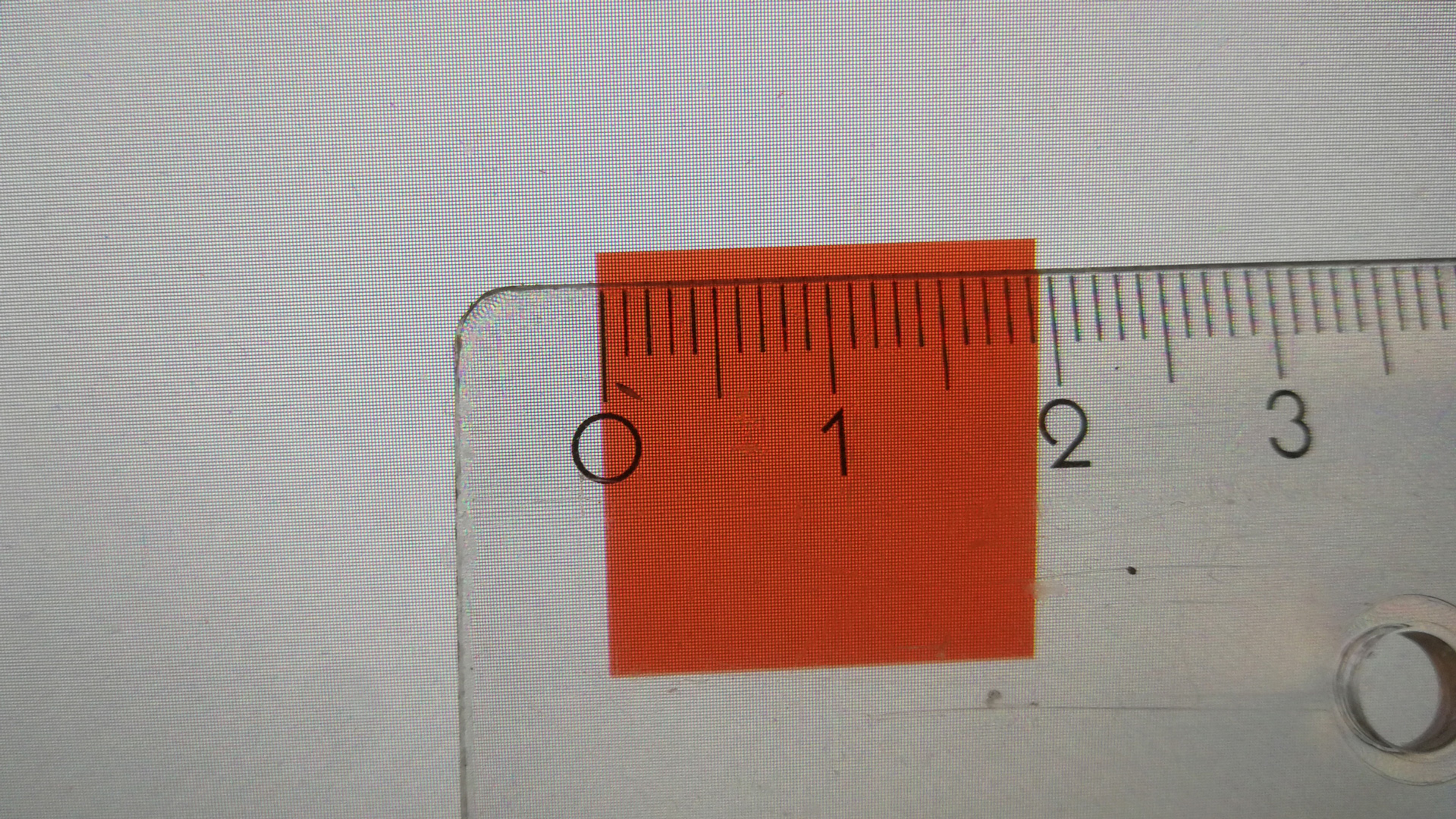 a ruler measuring the square on a screen