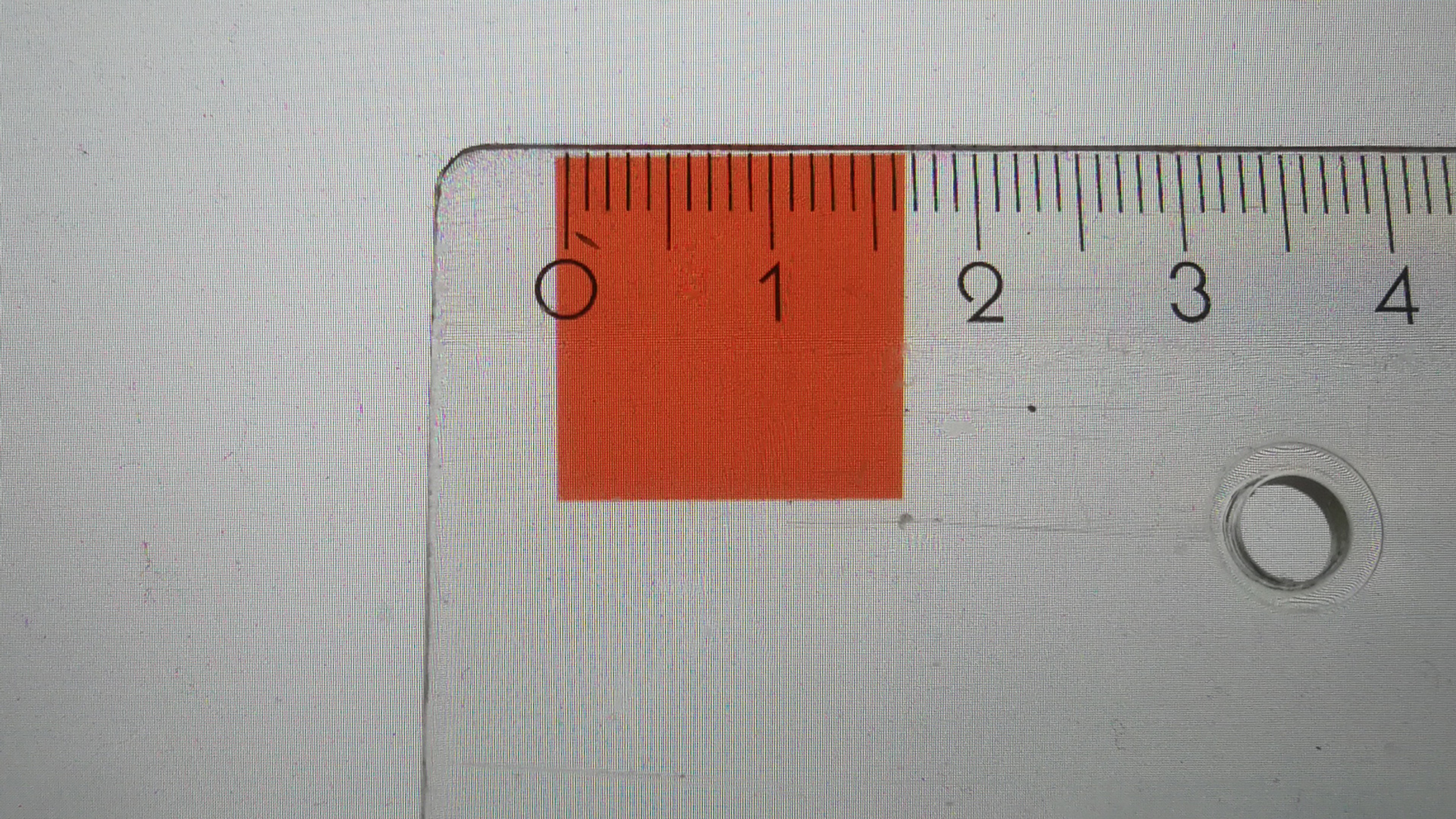 a ruler measuring the same square on another screen