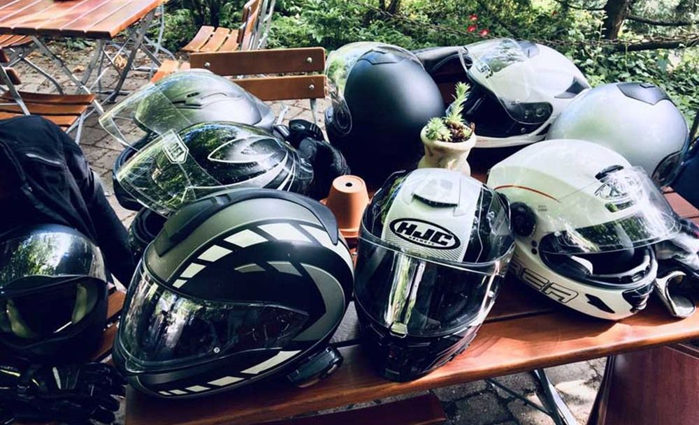 Motorcycle helmets lying on a bench