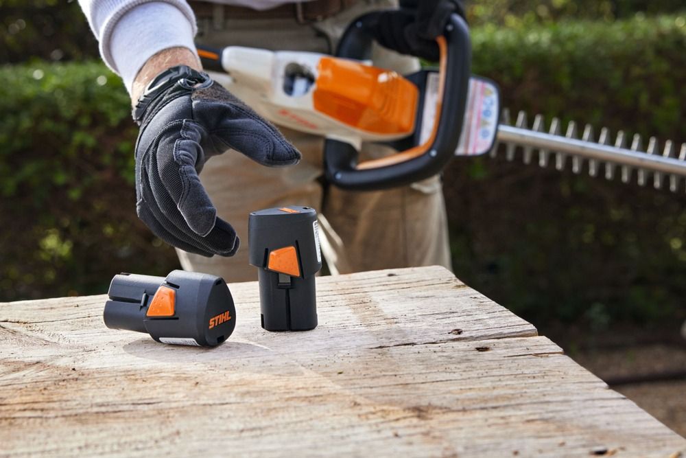 Stihl cordless hedge trimmer Battery being swapped