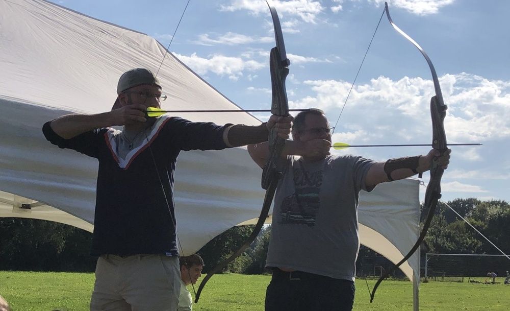 Two men doing archery