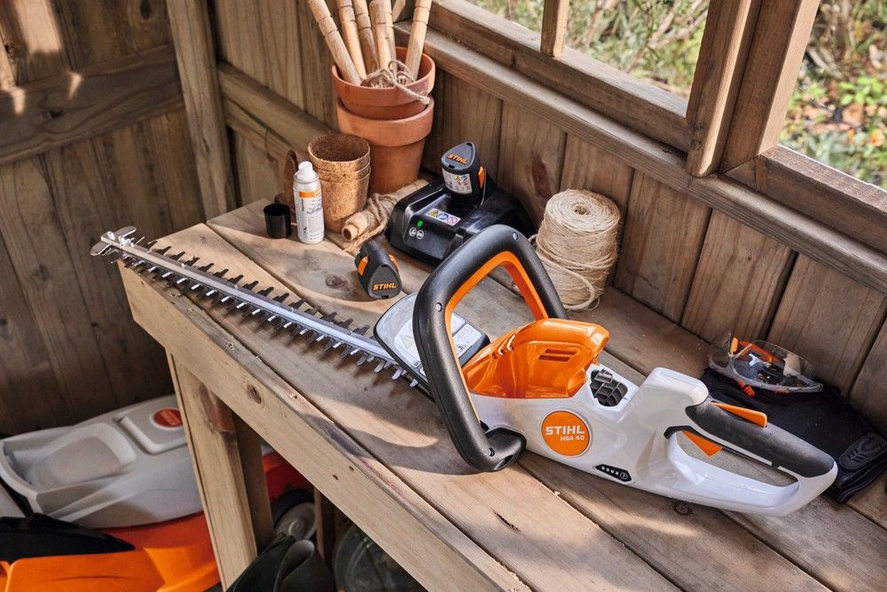 Stihl HSA40 cordless hedge trimmer in shed