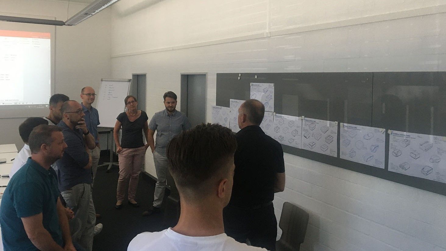 The team looks at posters