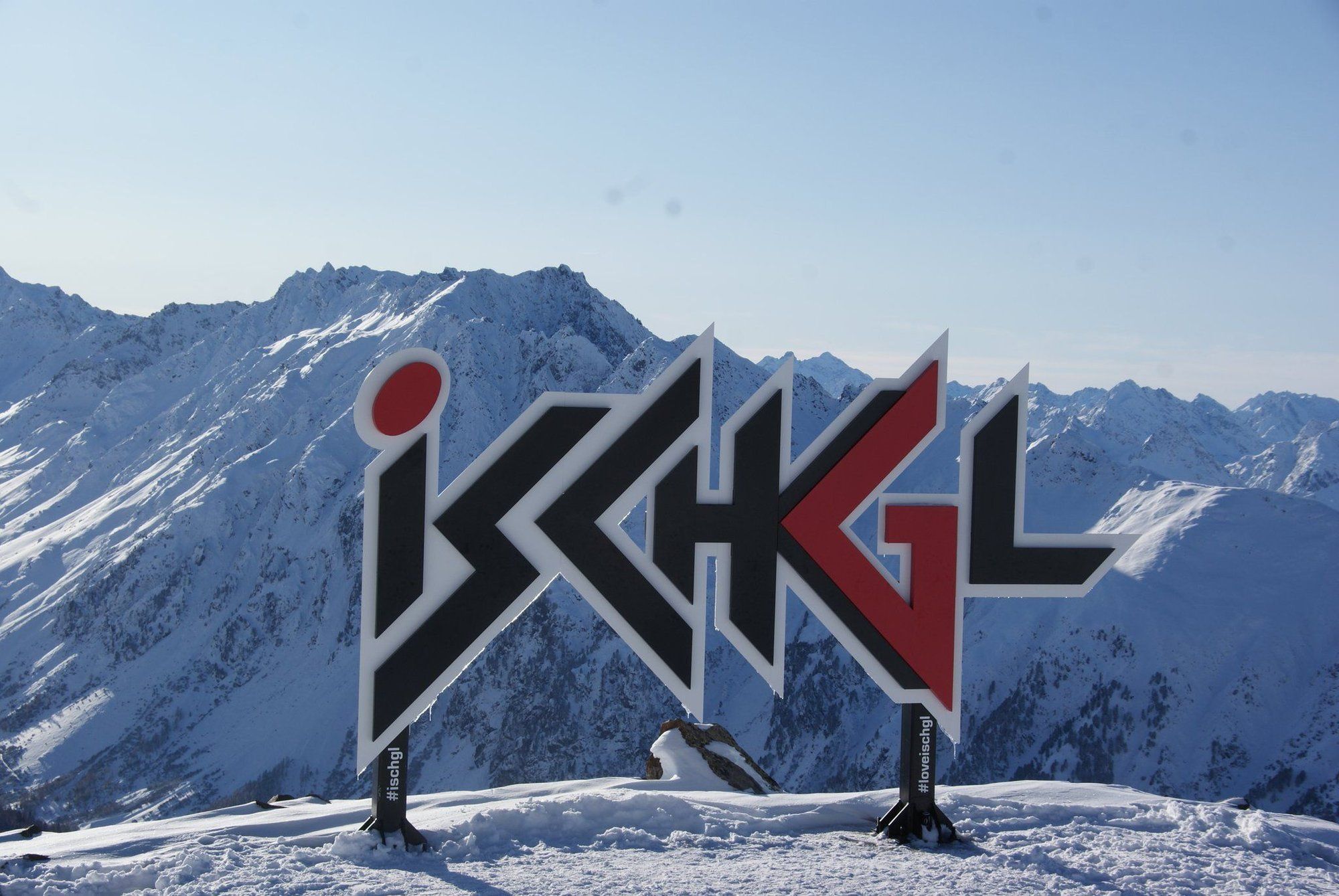 The picture shows the red and black "Ischgl" lettering in a snow and mountain landscape.