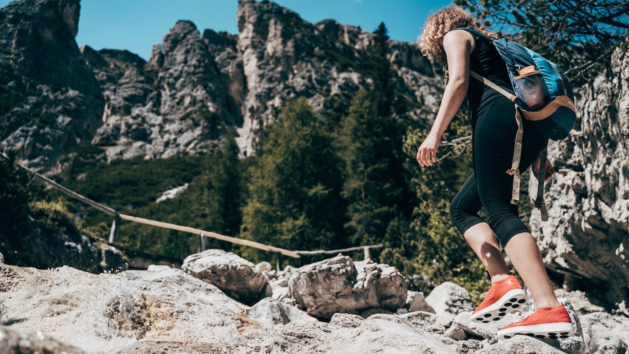 Woman hiking in the Dolomites with the Infinite One running shoes