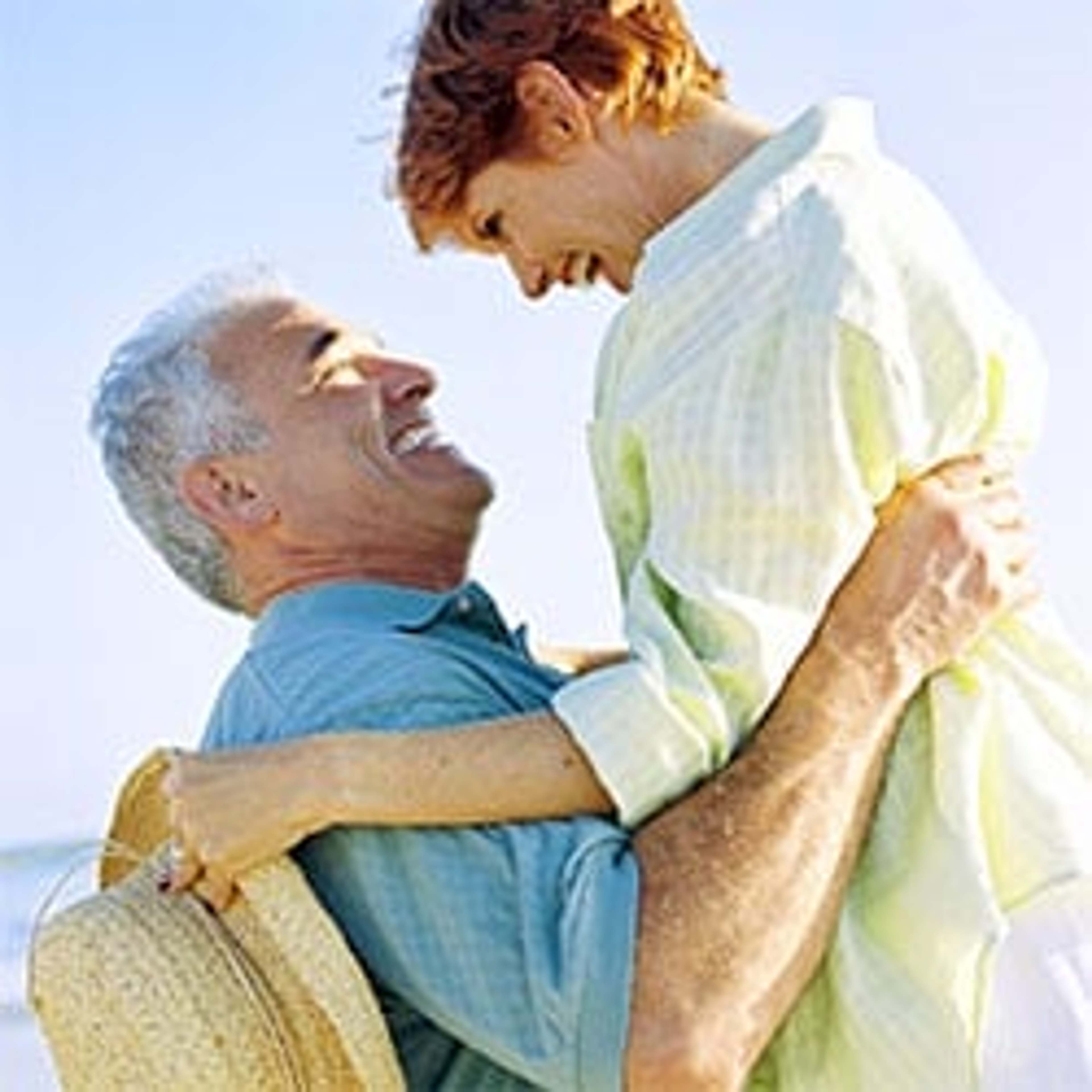 An elderly couple holding each other and enjoying a healthy and joint pain-free life