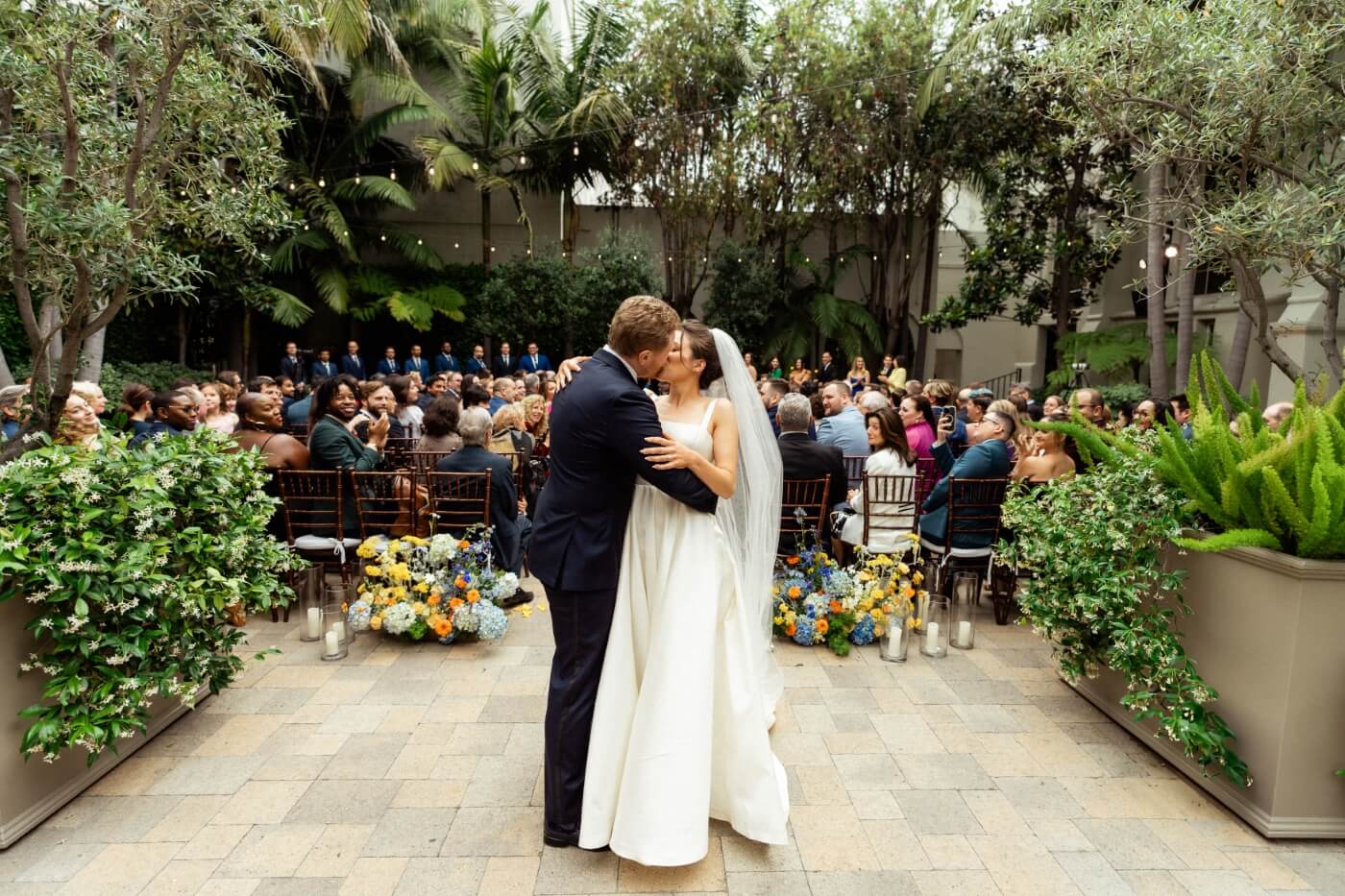 bride and groom kissing after ceremony