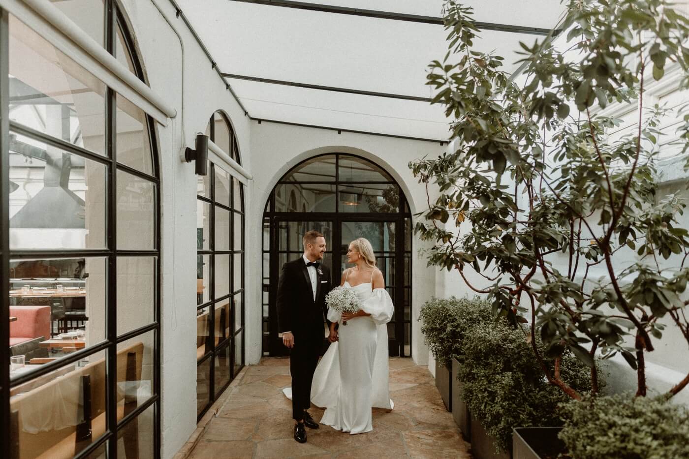 bride and groom in hallway