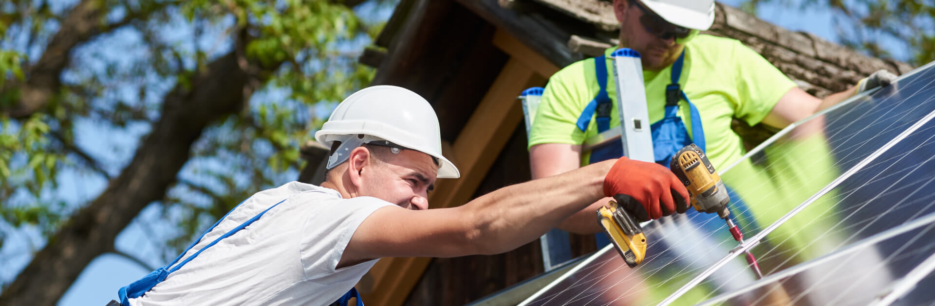 Tradesmen installing solar panels