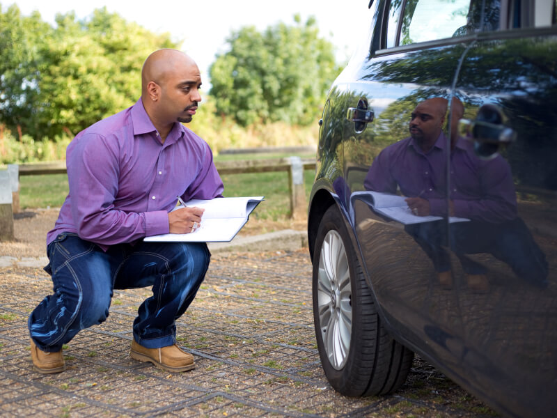 inspecting a car adobe 1.jpg