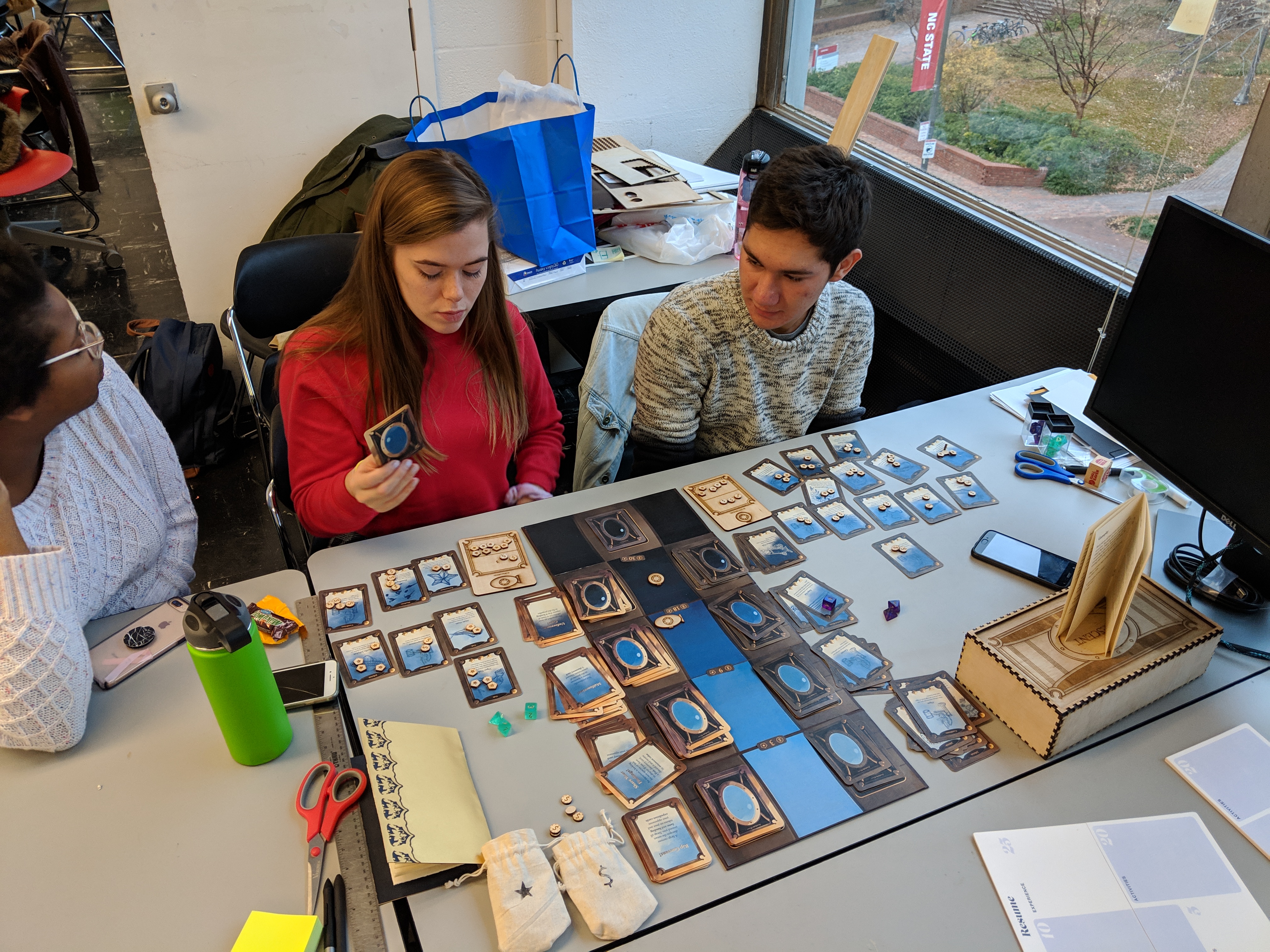 People Playing Game on Table