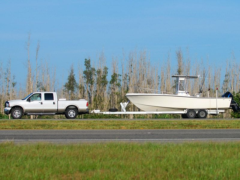 Truck Hauling Boat On Trailer ・  Photo by Autobytel Staff