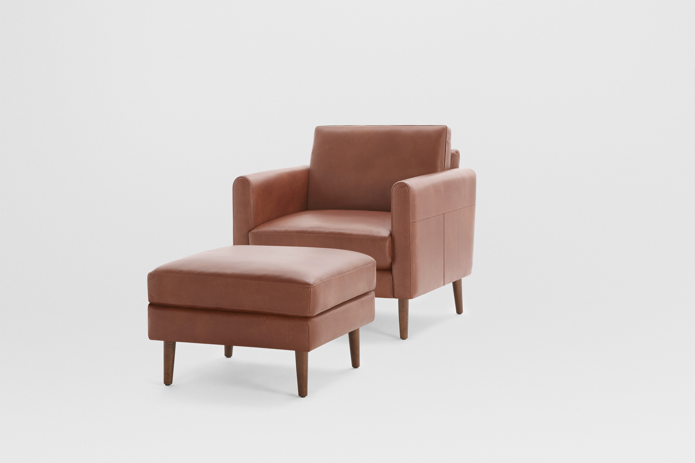 The Nomad Leather Club Chair with Ottoman Burrow