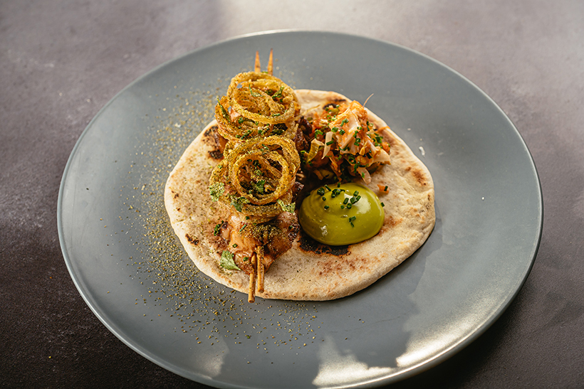 BBQ chicken thigh, flatbread, kimchi, spring onion aioli