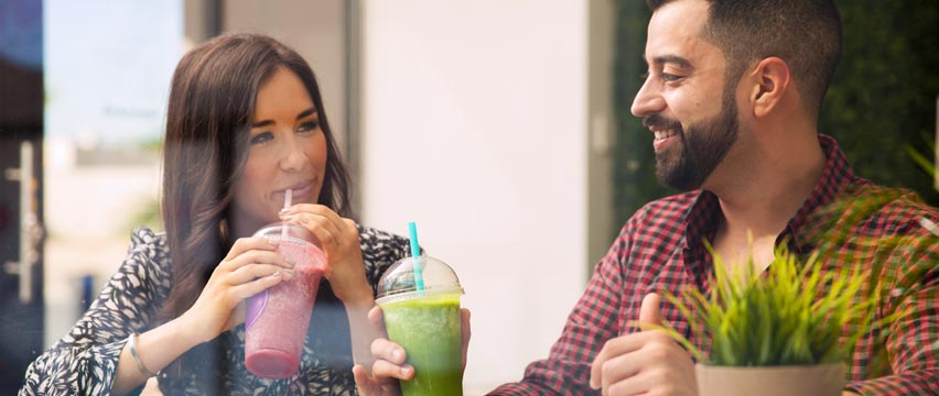 A couple drinking delicious smoothies