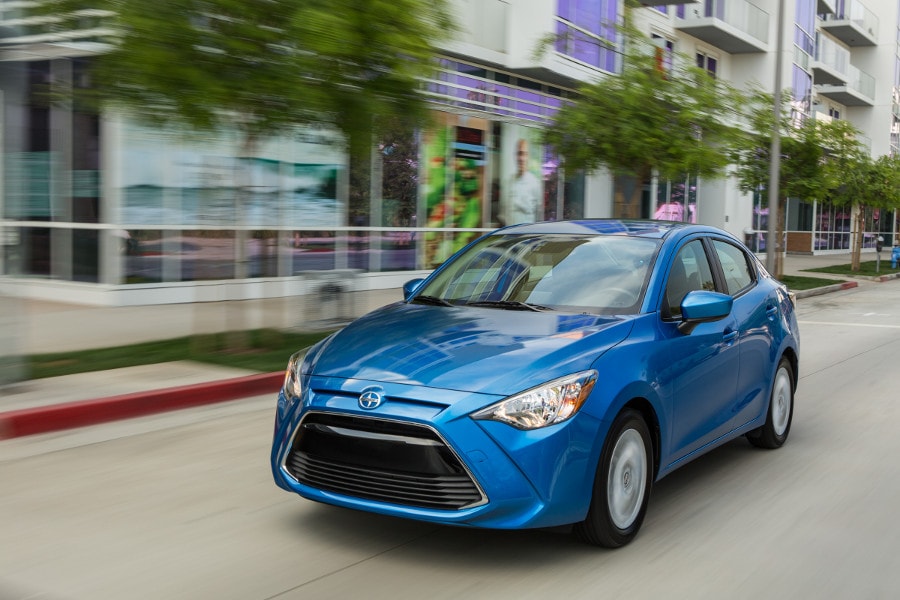 2016 Scion iA - Exterior - Blue - Front Driver Three-Quarter View ・  Photo by Scion 