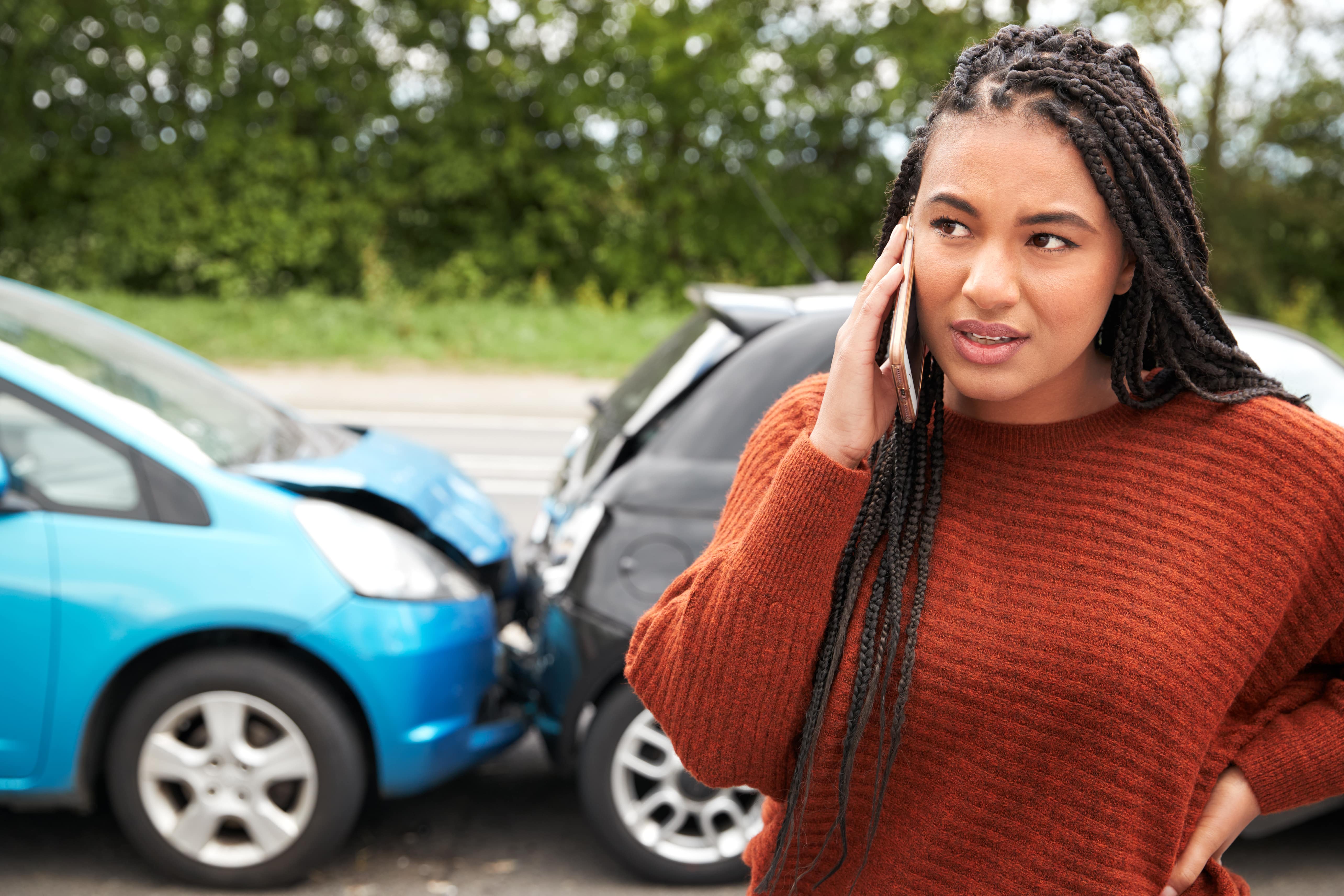 female-motorist-involved-in-car-accident-calling-i-2021-08-26-16-13-16-utc-min.jpg
