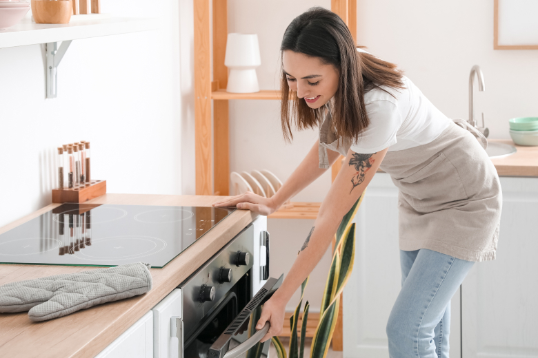 Woman checking her oven