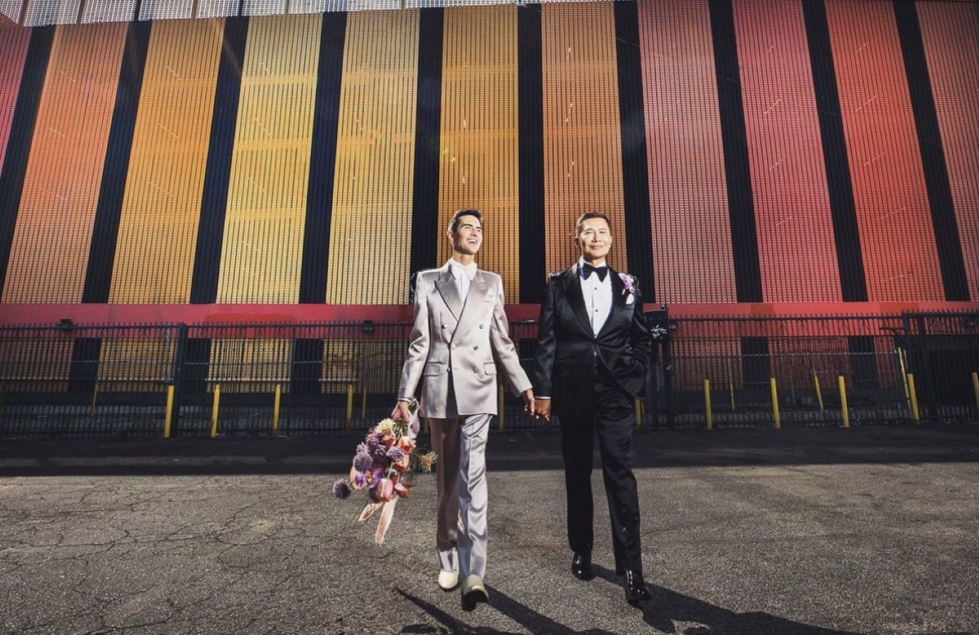 two grooms holding hands