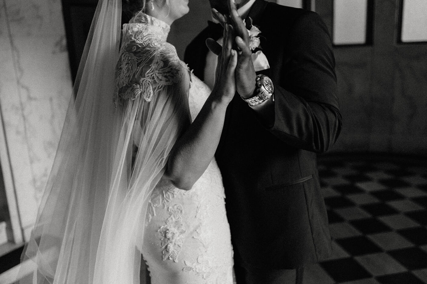 bride and groom hand hold dancing