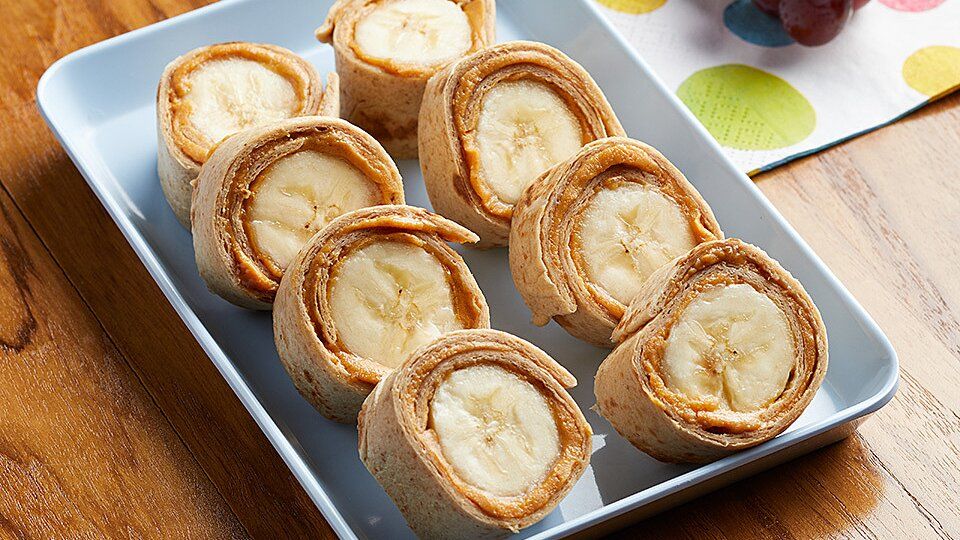 Sliced peanut butter and banana rollups, some of the best vegetarian camping snacks