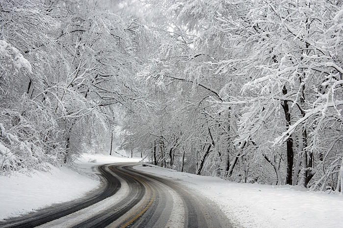 Icy and snowy roads can make for difficult driving conditions.