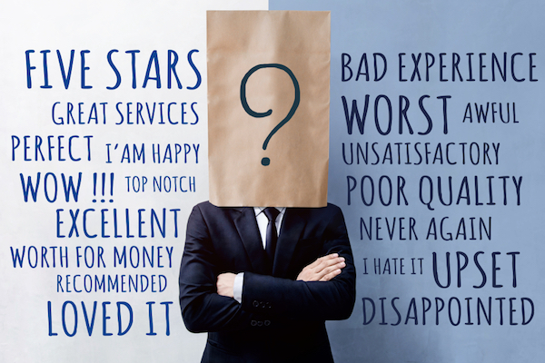 image of man with paper bag on head with negative and positive reviews behind