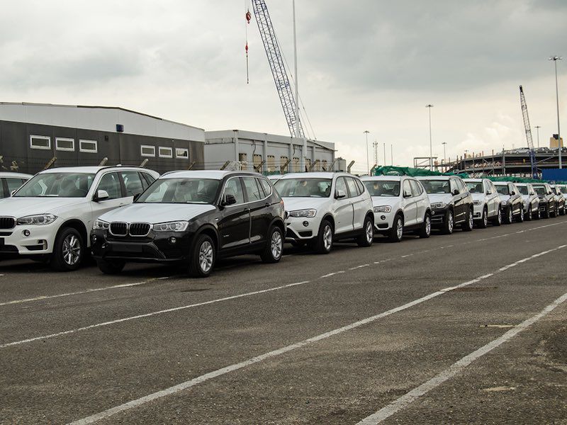 New cars at port ・  Photo by Bigstock 