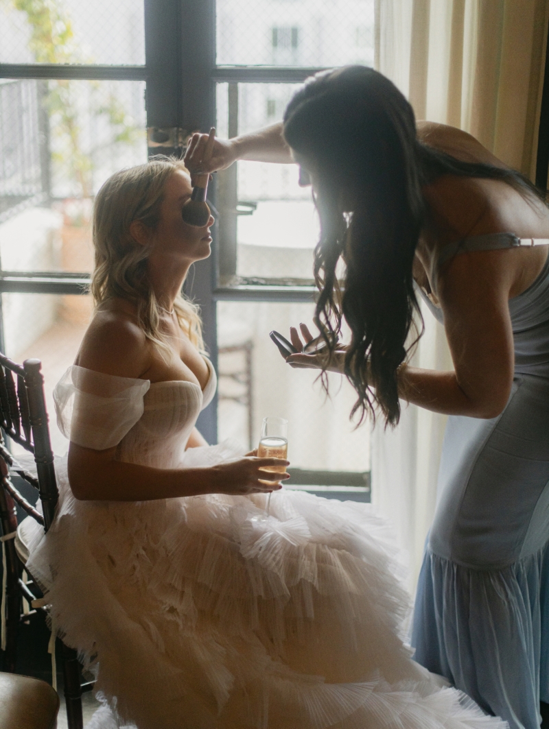 a bride gets ready in her wedding suite in DTLA cathedral wedding