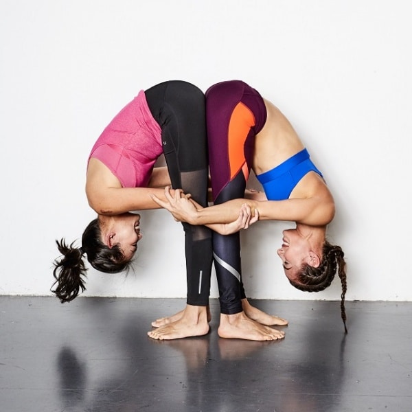 Easy-Yoga-Poses-For-Two-People-Beginners-Guide-To-Couples-Yoga-forward-bend-2-600x600.jpg