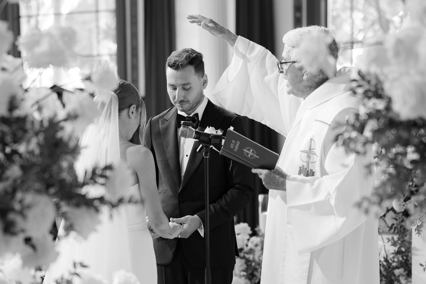 a pastor leads a bride and groom through their wedding ceremony