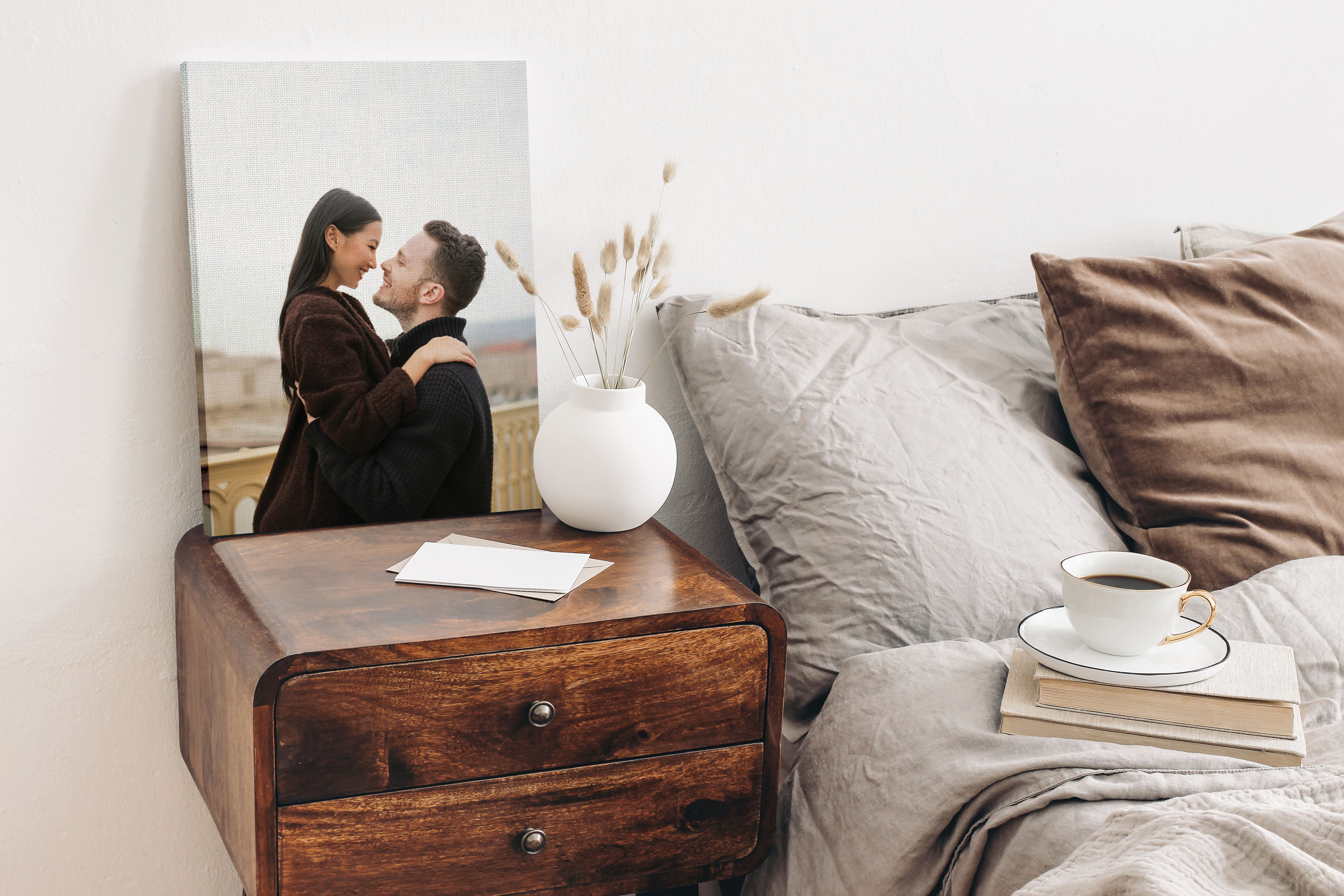Canvas print on bedside table of couple.