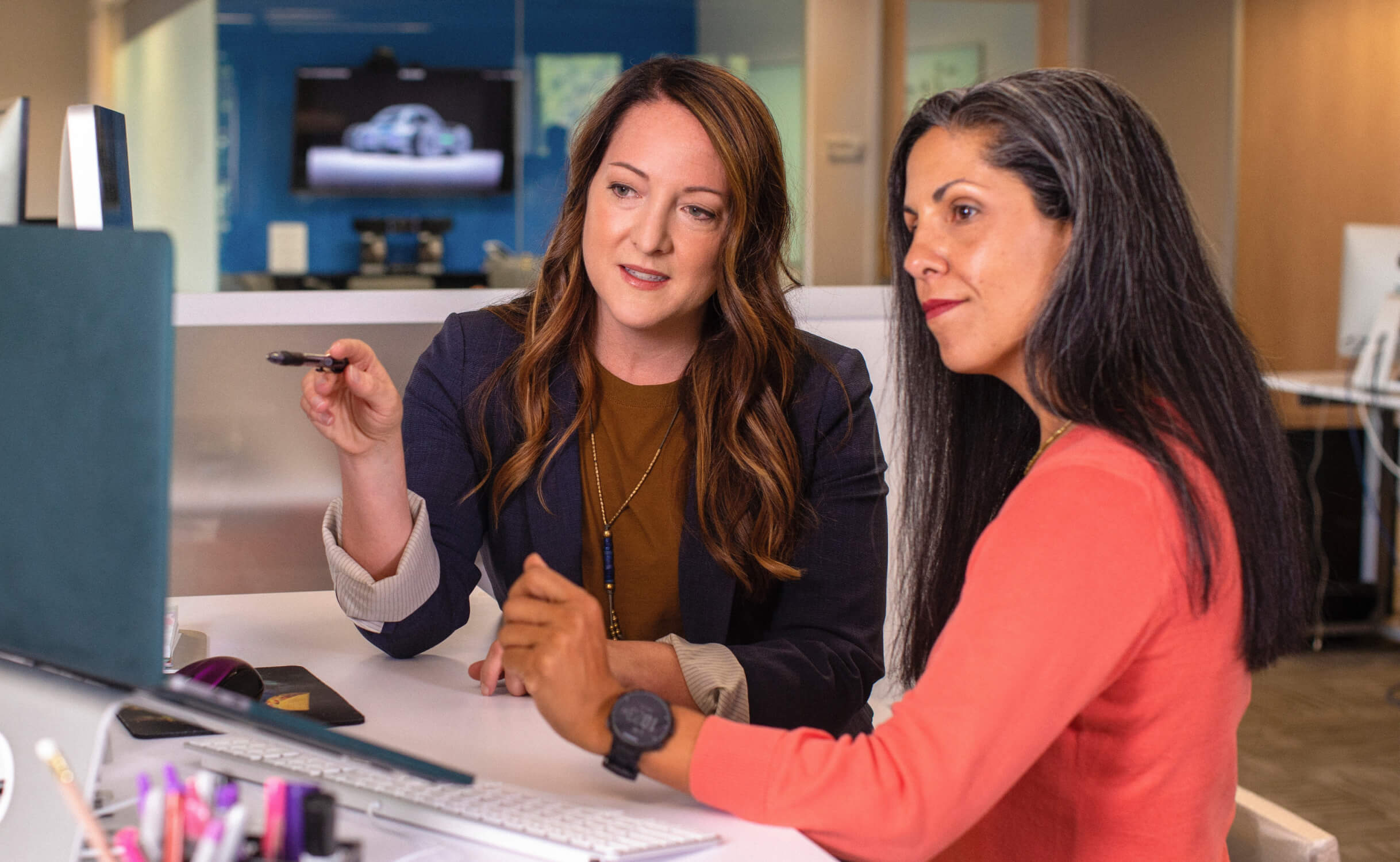 Two women picking out a retirement plan with Morgan Stanley