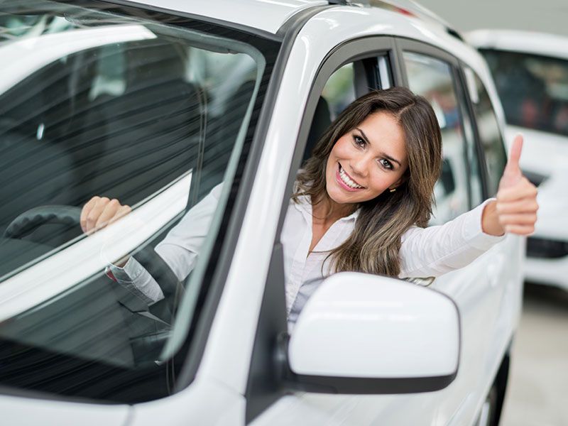 iStock thumbs up behind wheel 