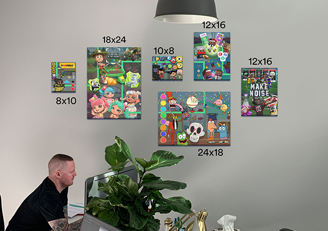 a wall of numerous different canvas prints with their sizes above