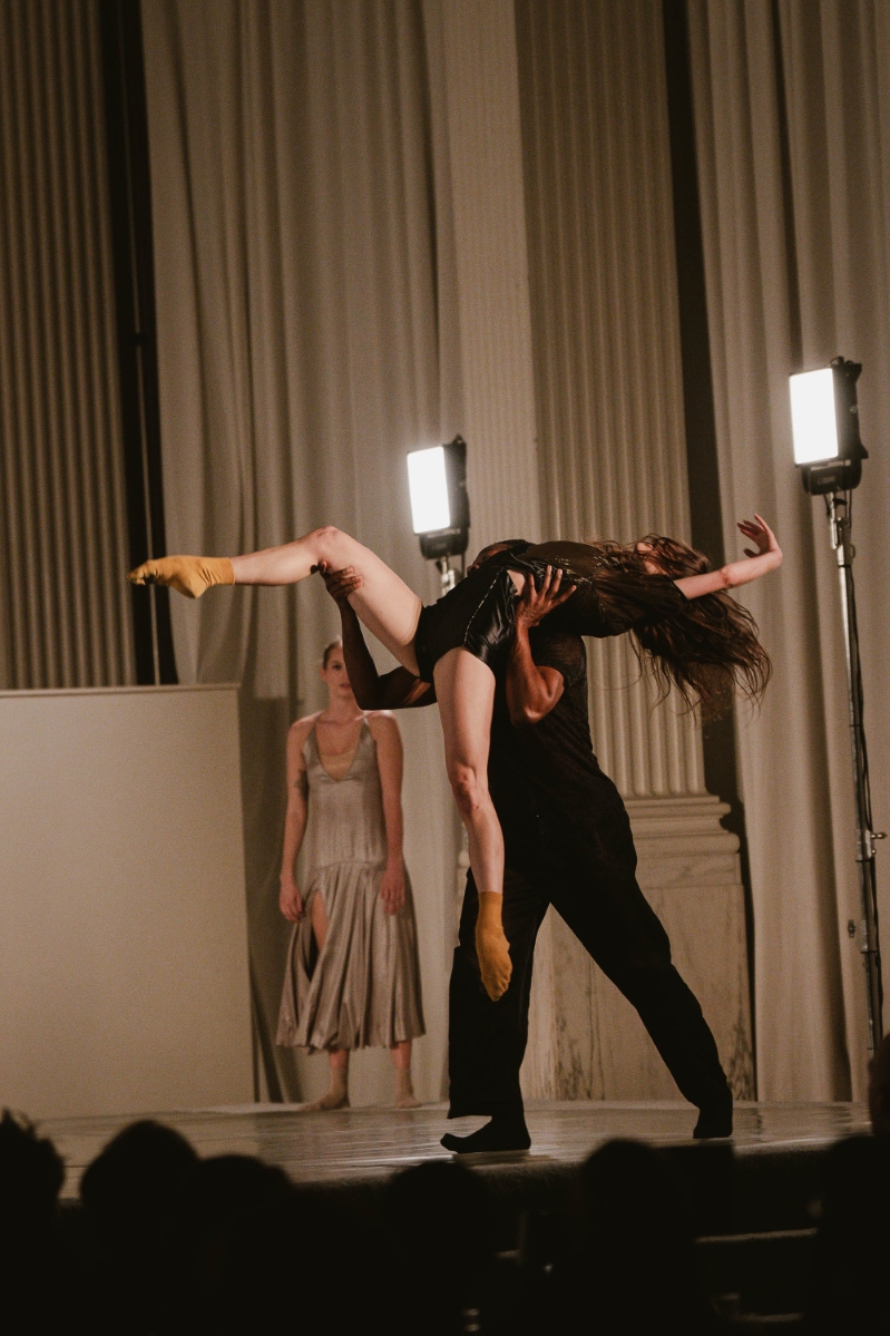 a male dancer carries a female dancer, and she leans back into the pose, at a dance performance at a gala at Vibiana in Downtown Los Angeles