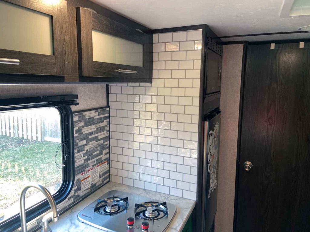 Tile backsplash in a kitchen area in an RV after a RV makeover