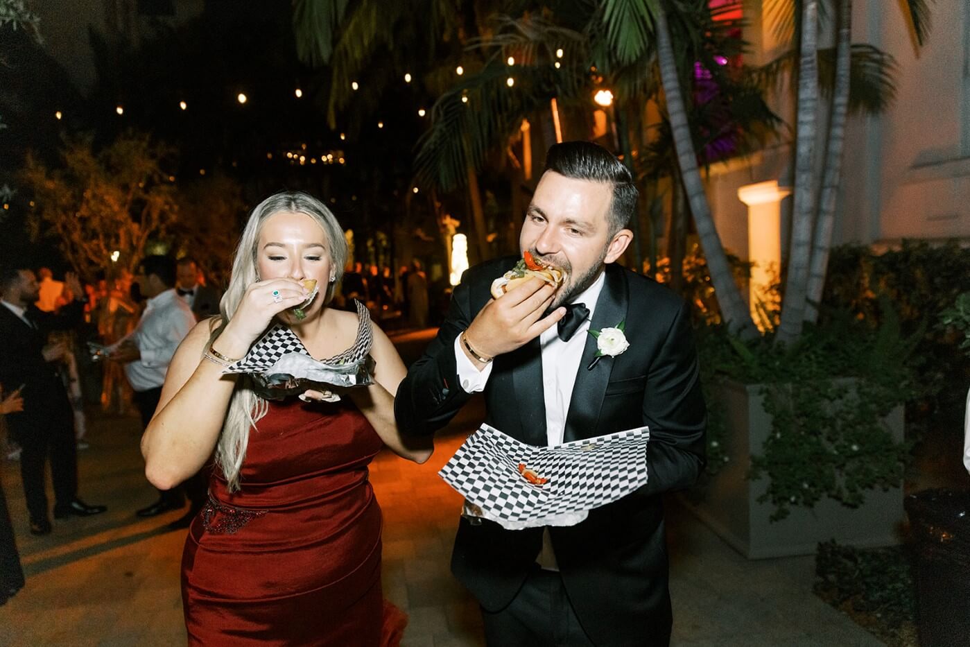 bride and groom eating late night food 