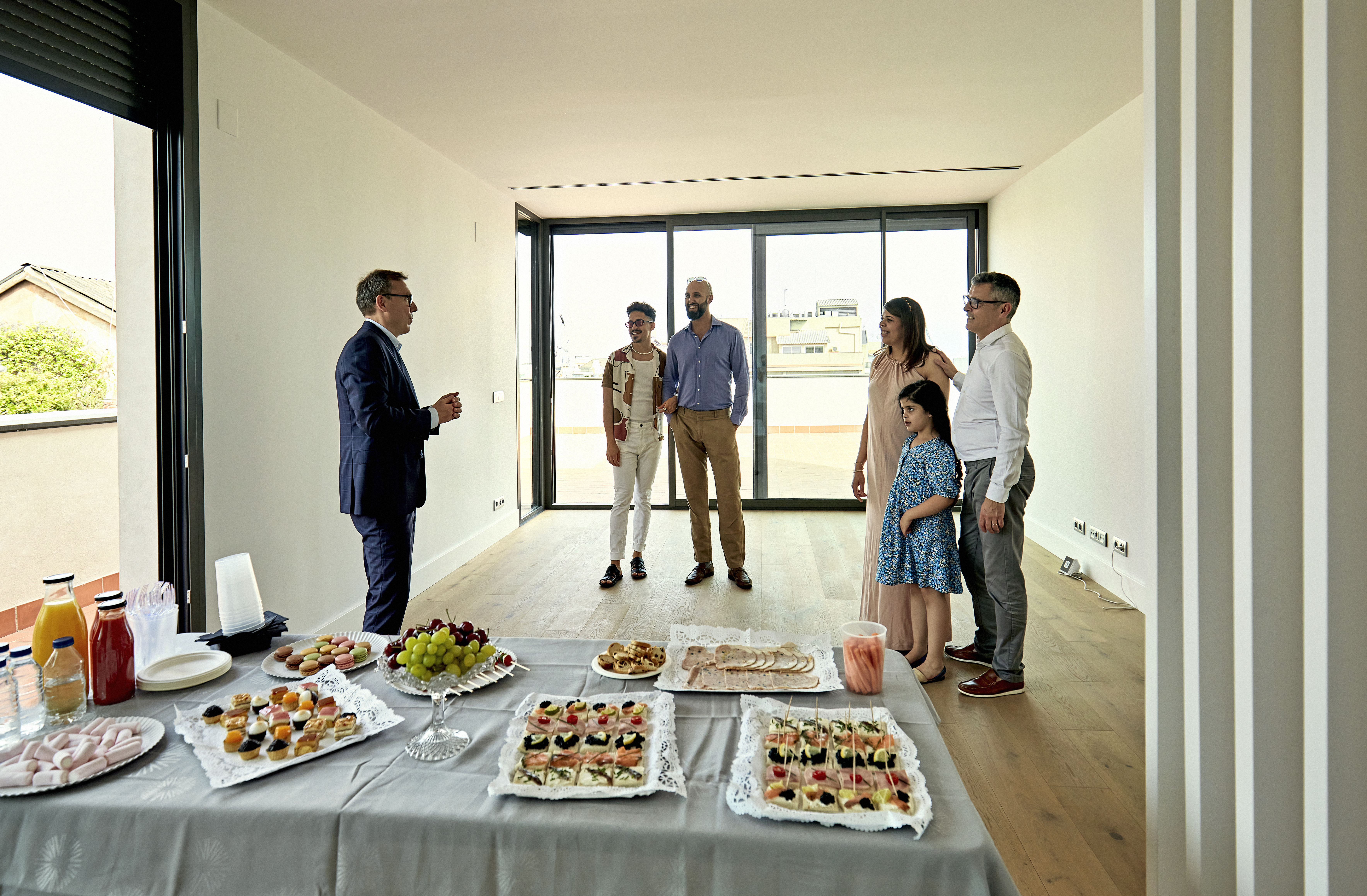 Real estate agent and potential buyers at an open house