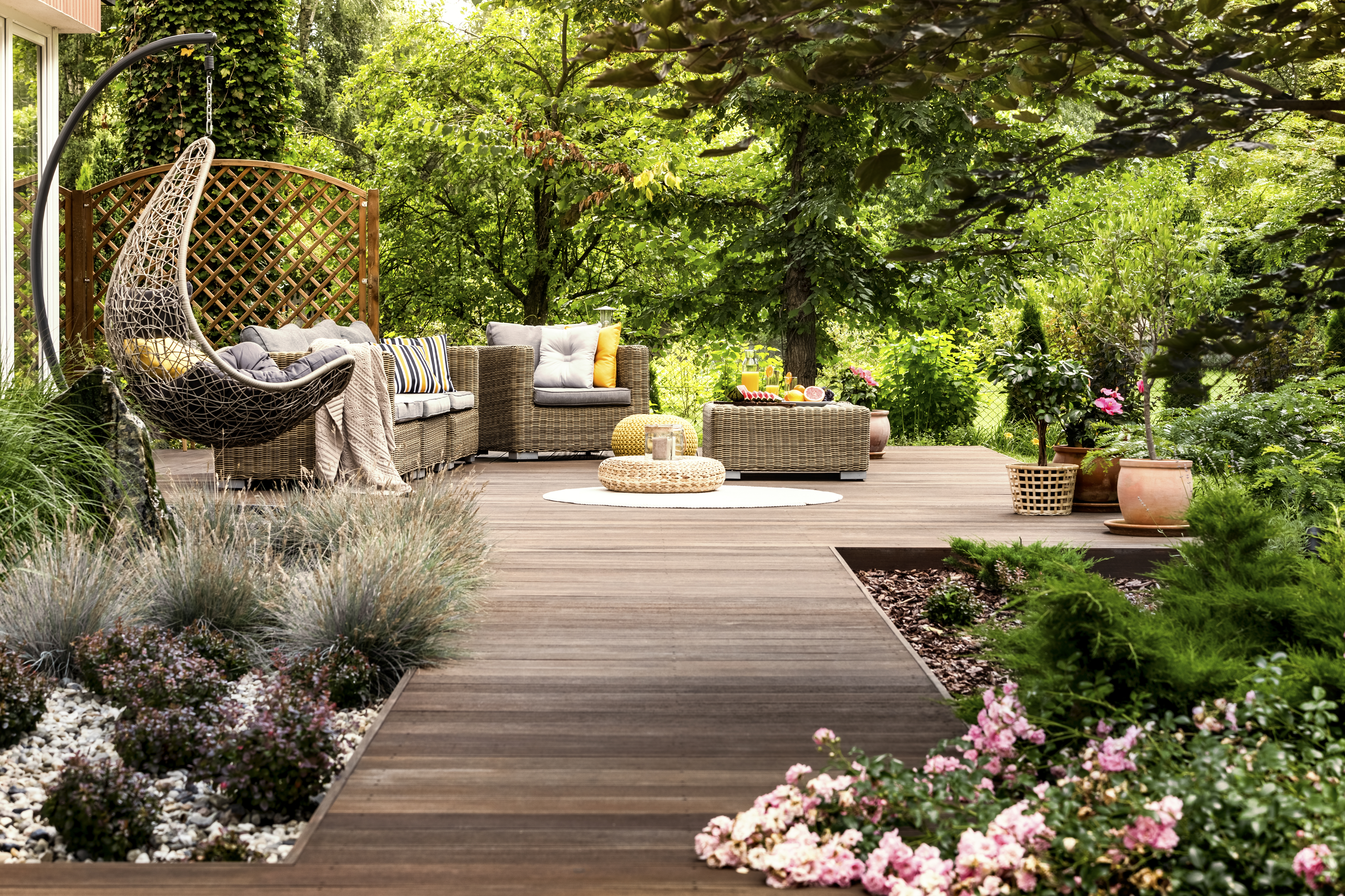 Wooden terrace surrounded by greenery