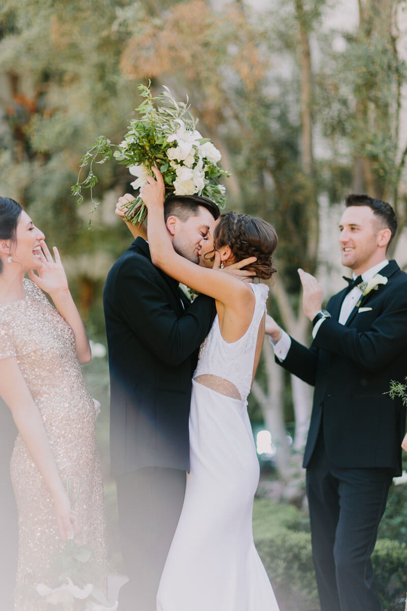 bride and groom kiss